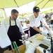 Chef Steven Grostick and grill chef Doug Perkins work outside at the grill during lunch at the Produce Station on Thursday afternoon. Melanie Maxwell | AnnArbor.com